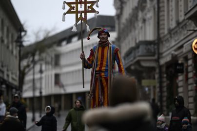 Stilt walker in costume at Vilnius street festival, capturing urban celebrations.